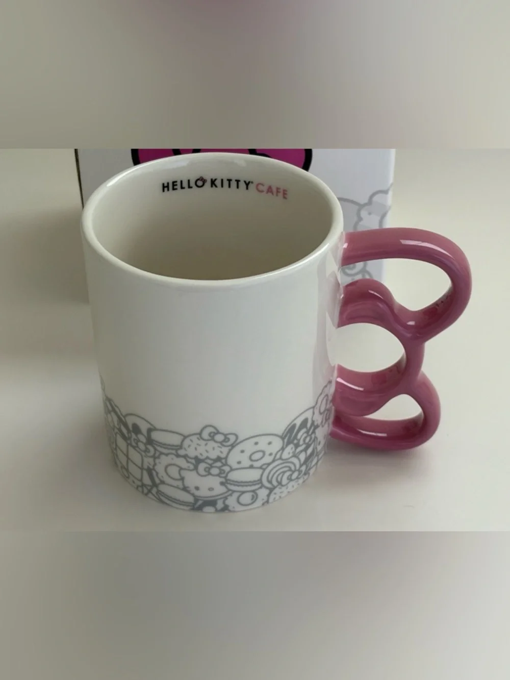 NIB Hello Kitty Cafe White Mug Pink Handle Gray Graphics Logo Box Artwork 12 oz